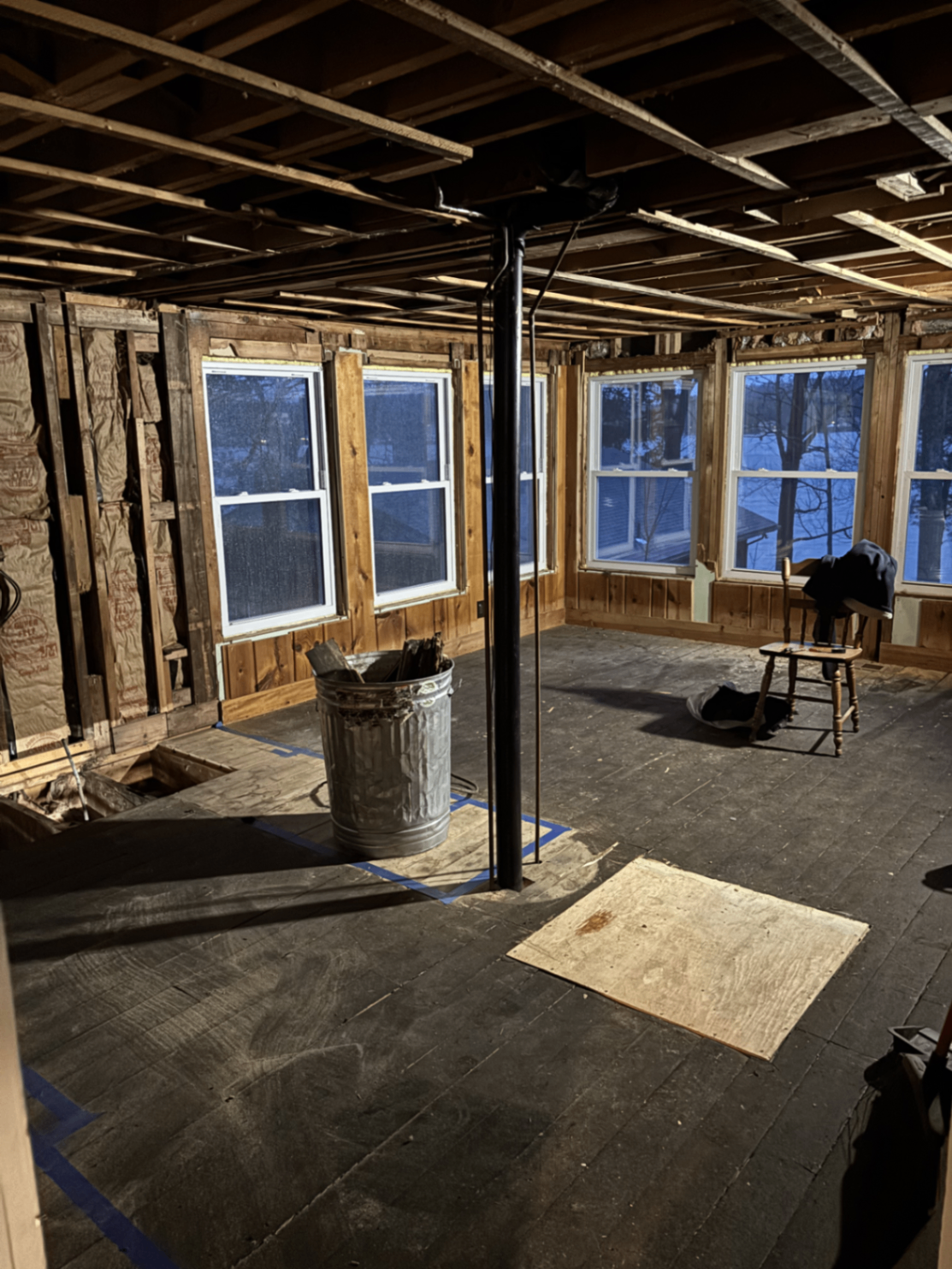 Gutted lakeside room framed to studs with temporary support post