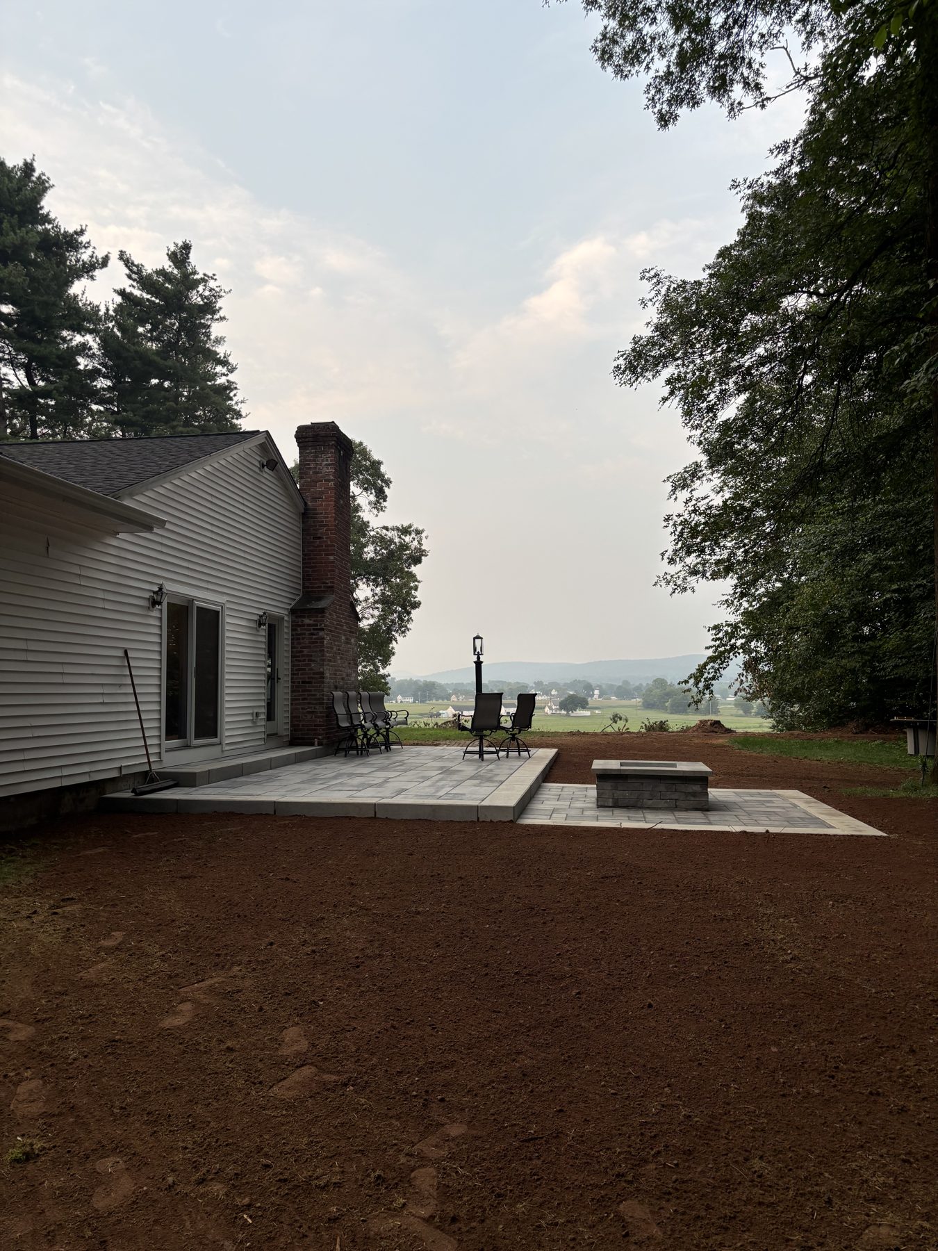 Stone patio with firepit and fieldstone edging