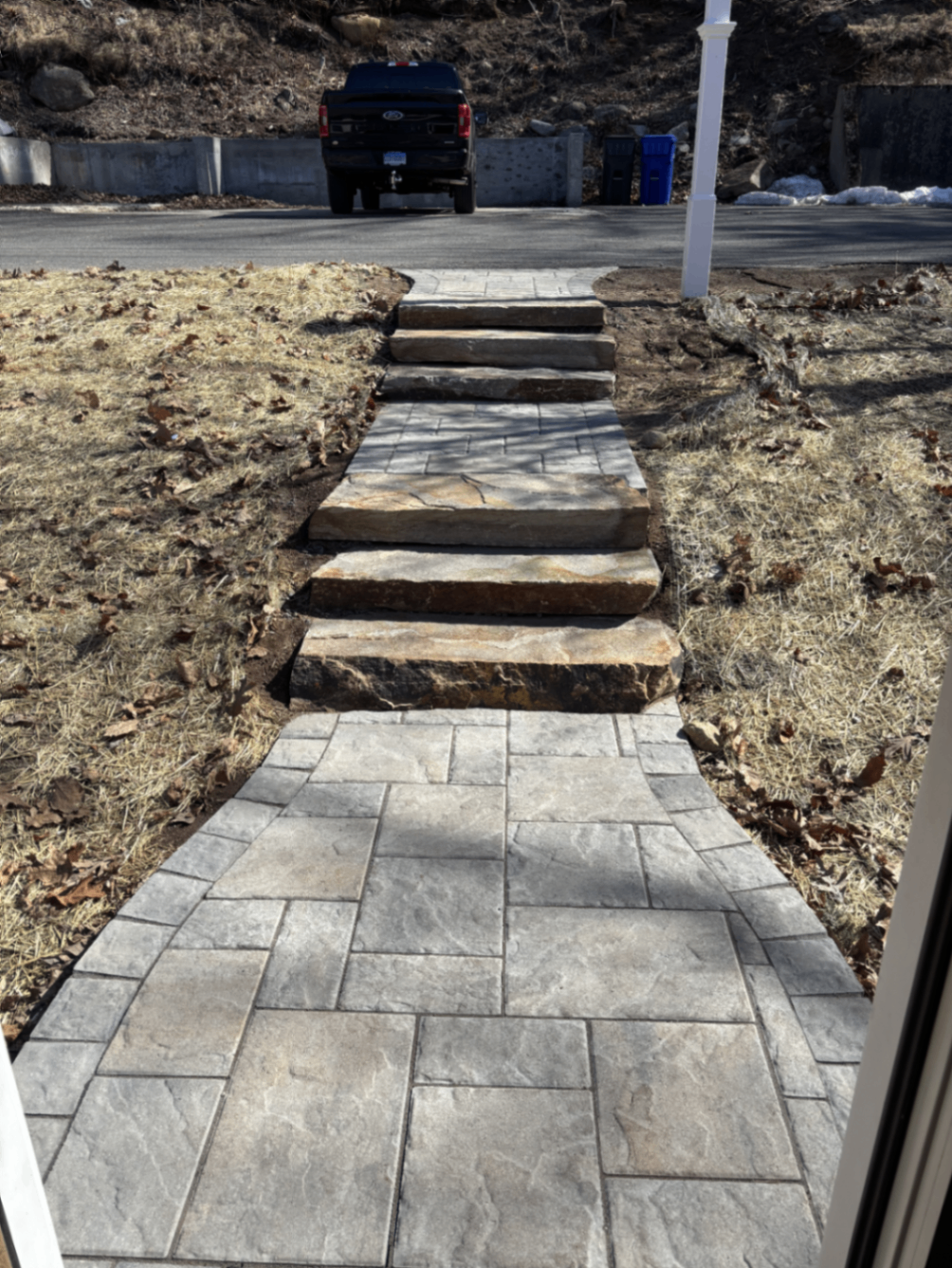 Finished paver walkway with natural stone slab steps