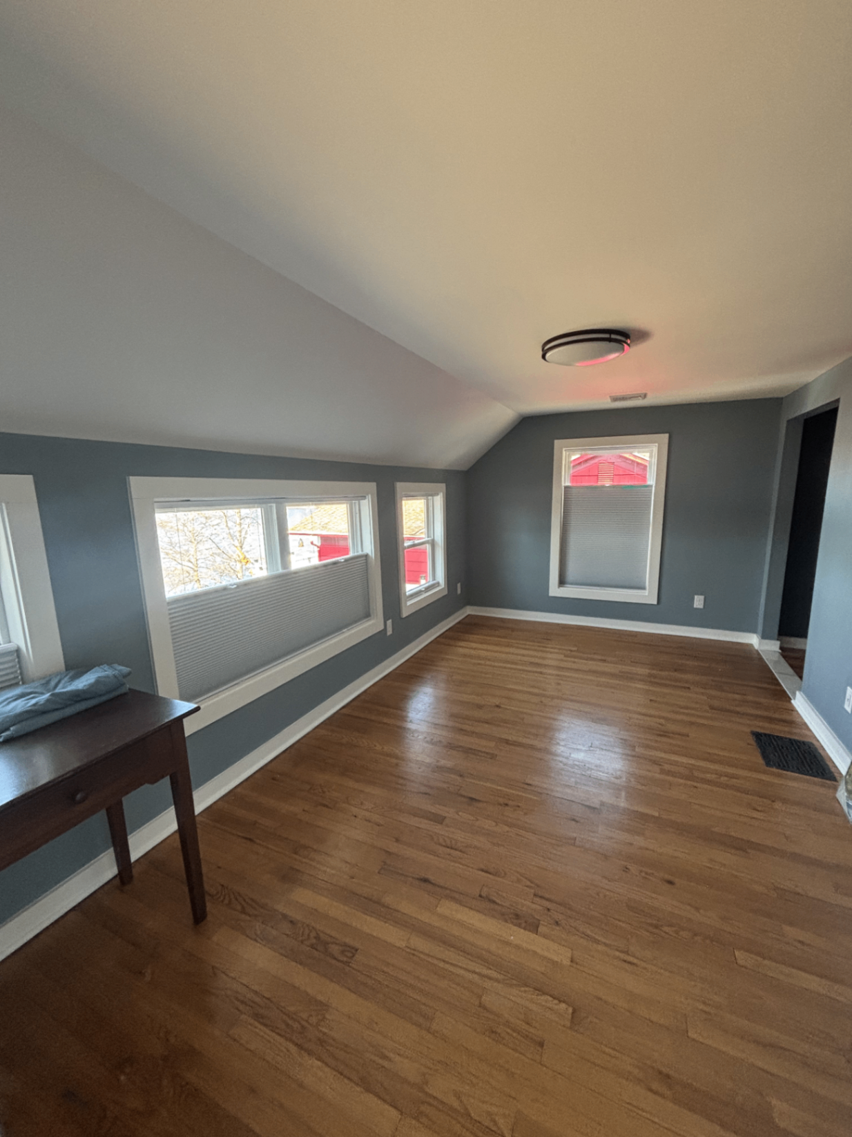 Renovated upstairs bedroom with refinished hardwood floors