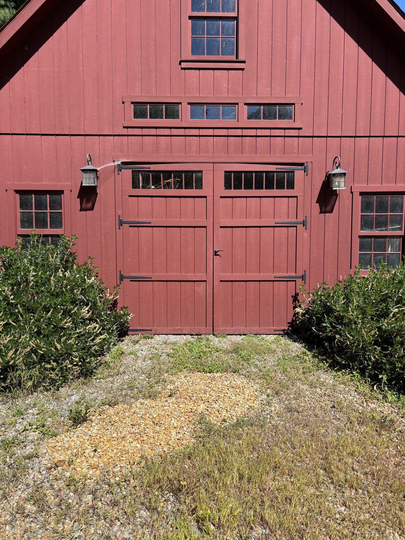 Red board and batten barn with carriage garage door