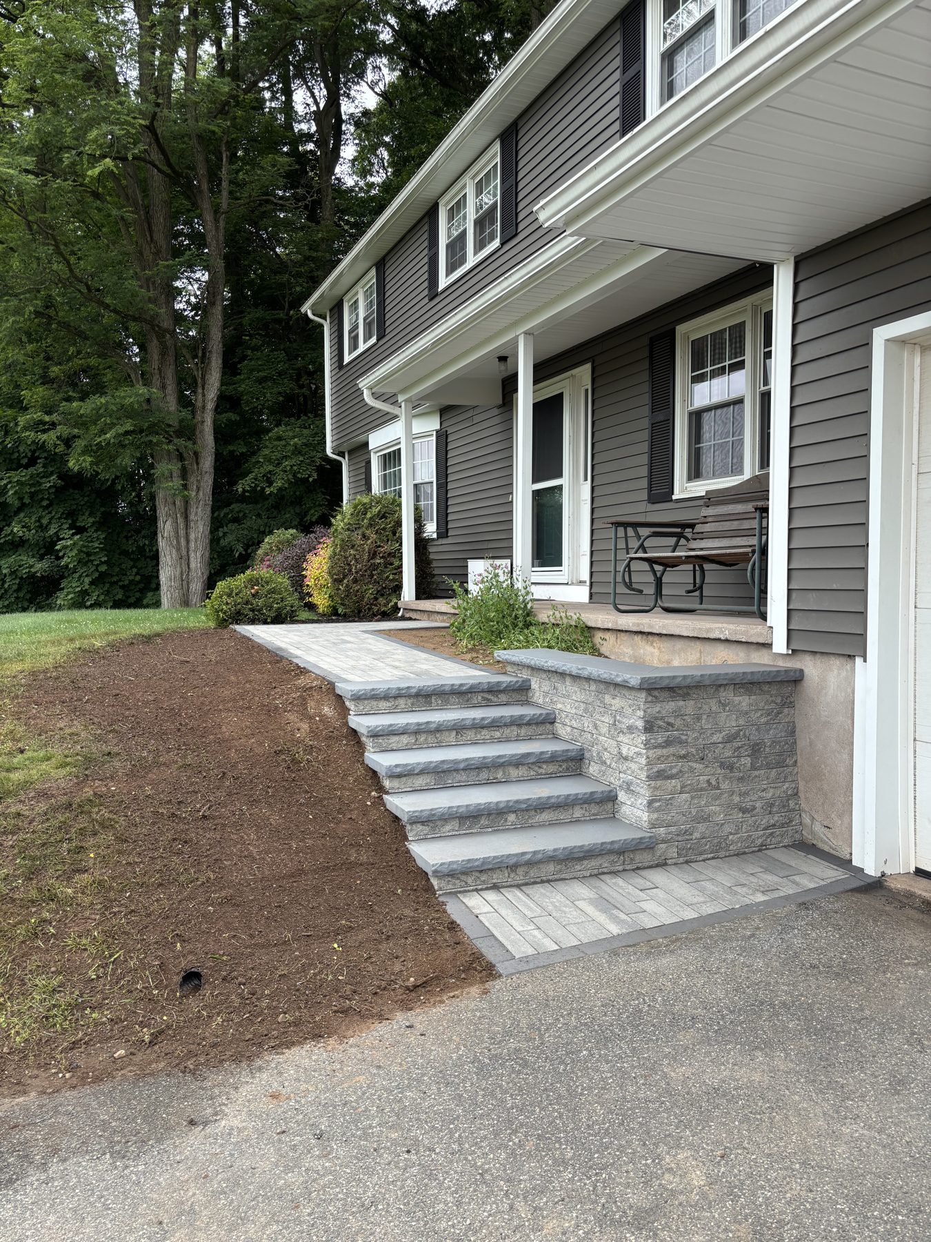 Bluestone treads with granite risers at front entry